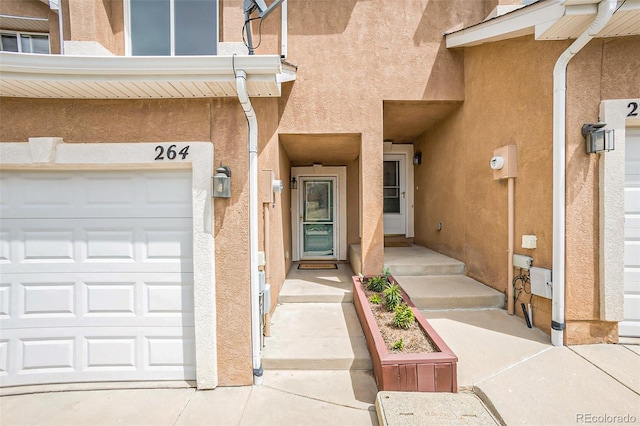 doorway to property featuring a garage