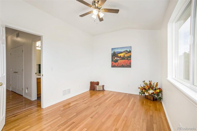 unfurnished room with ceiling fan and light hardwood / wood-style floors