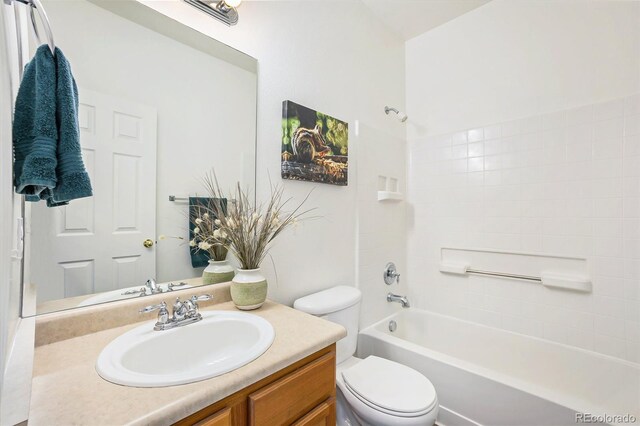 full bathroom with bathtub / shower combination, vanity, and toilet