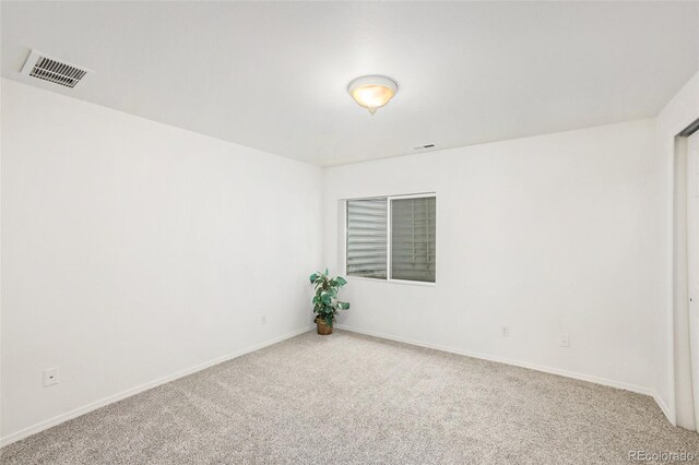 view of carpeted spare room