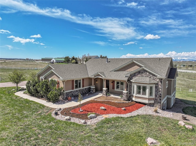19045 Shiloh Ranch Dr, Colorado Springs, CO 80908 - view of front of property with stucco siding, a front yard, and stone siding