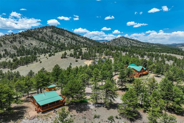 70 Elk Cir, Guffey, CO 80820 - drone / aerial view of a mountainous background and a heavily wooded area
