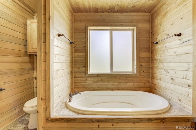 70 Elk Cir, Guffey, CO 80820 - bathroom featuring wood walls, a bath, and wooden ceiling