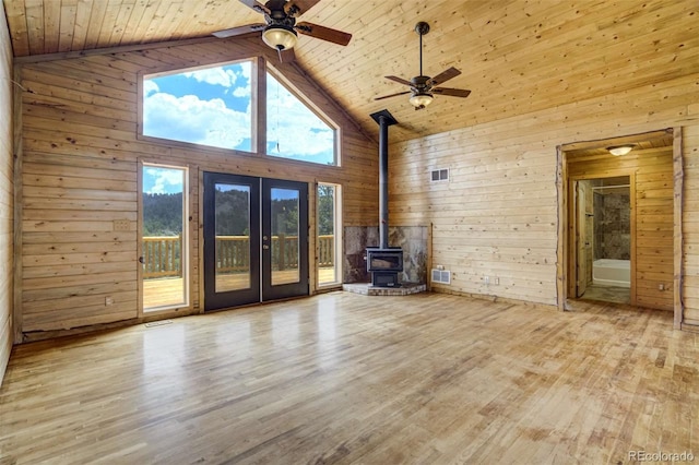70 Elk Cir, Guffey, CO 80820 - unfurnished living room with wooden walls, wood ceiling, a wood stove, high vaulted ceiling, and ceiling fan