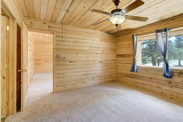 70 Elk Cir, Guffey, CO 80820 - unfurnished room featuring wooden ceiling, wood walls, carpet floors, and a ceiling fan