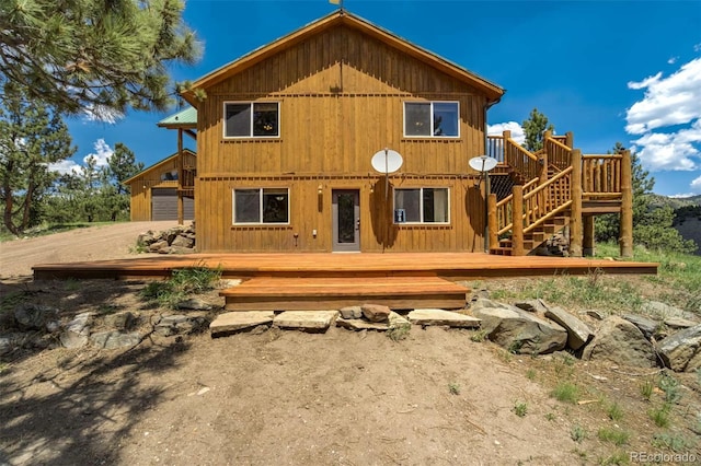 70 Elk Cir, Guffey, CO 80820 - back of property featuring a deck and stairway