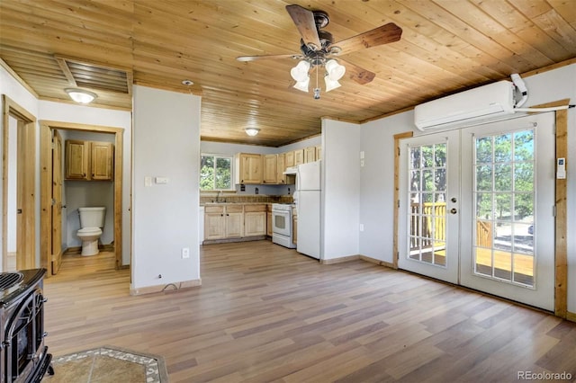 70 Elk Cir, Guffey, CO 80820 - kitchen featuring an AC wall unit, white appliances, french doors, wooden ceiling, and a wood stove