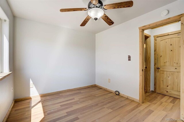70 Elk Cir, Guffey, CO 80820 - unfurnished room with light wood finished floors and a ceiling fan