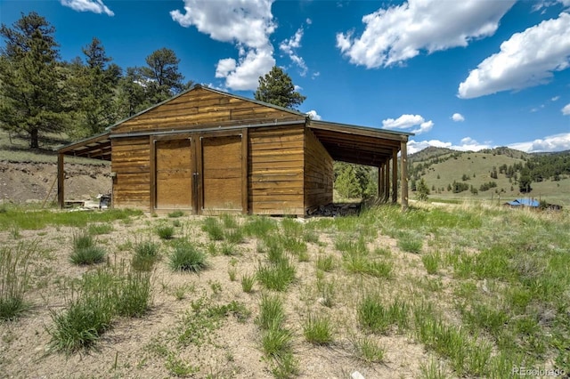 70 Elk Cir, Guffey, CO 80820 - view of outbuilding with a carport and a mountain view