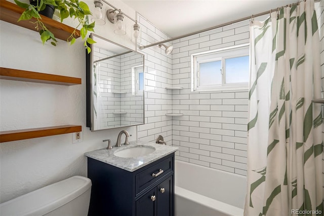 full bath featuring vanity, toilet, and shower / tub combo