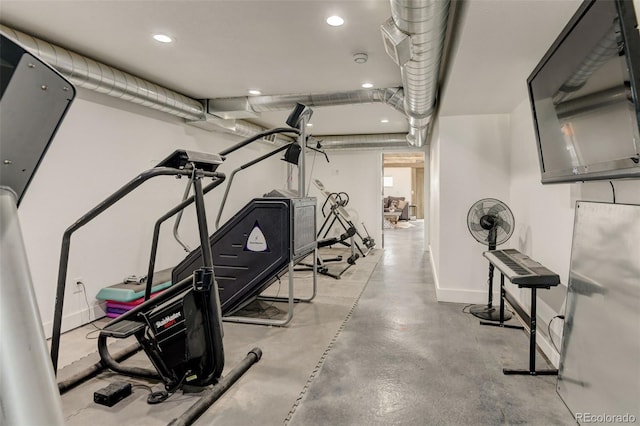 exercise area with baseboards and recessed lighting