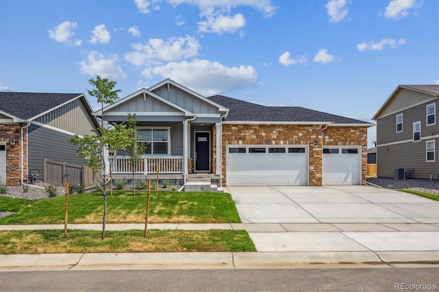 1144 Ridgefield Dr, Berthoud, CO 80513 - craftsman inspired home with an attached garage, board and batten siding, driveway, stone siding, and covered porch