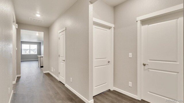 1144 Ridgefield Dr, Berthoud, CO 80513 - hallway with dark wood-type flooring and baseboards