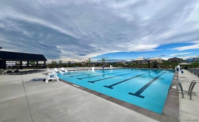 1144 Ridgefield Dr, Berthoud, CO 80513 - community pool featuring a patio area