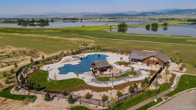 1144 Ridgefield Dr, Berthoud, CO 80513 - view of subject property with a water and mountain view and a pool area
