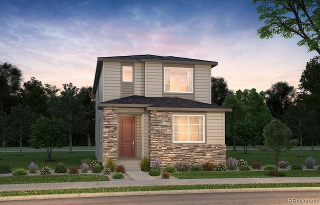 6310 N Malaya St, Aurora, CO 80019 - view of front facade with stone siding and a front lawn