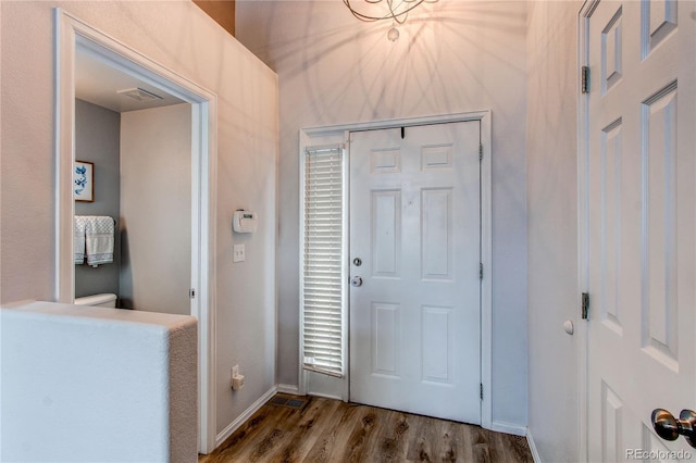 entrance foyer featuring dark hardwood / wood-style flooring