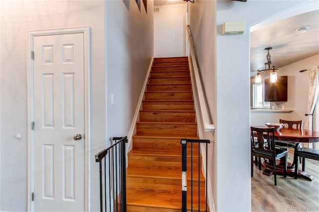 stairway with wood-type flooring