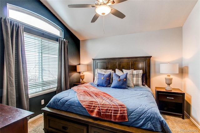 carpeted bedroom with ceiling fan and lofted ceiling