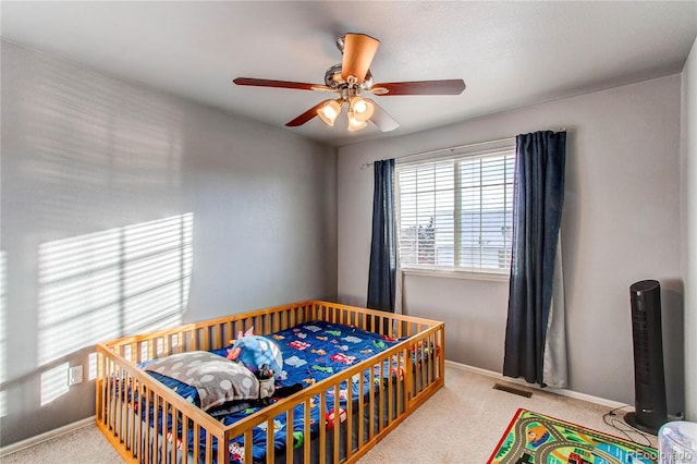 carpeted bedroom with ceiling fan