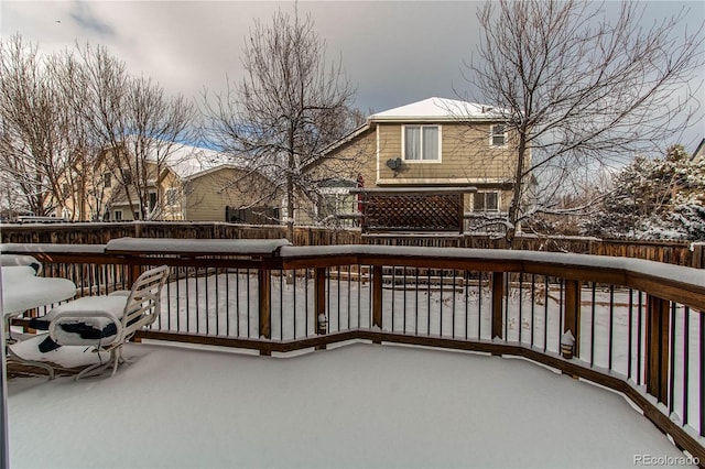 view of snow covered deck