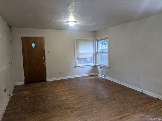 4209 Perry St, Denver, CO 80212 - empty room with wood finished floors and a textured ceiling