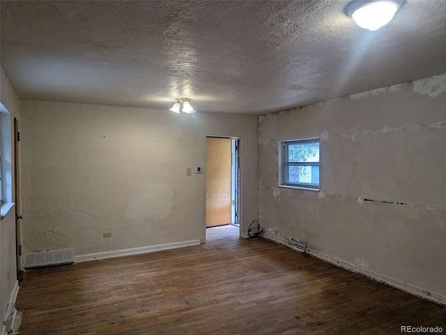4209 Perry St, Denver, CO 80212 - unfurnished room with wood finished floors and a textured ceiling