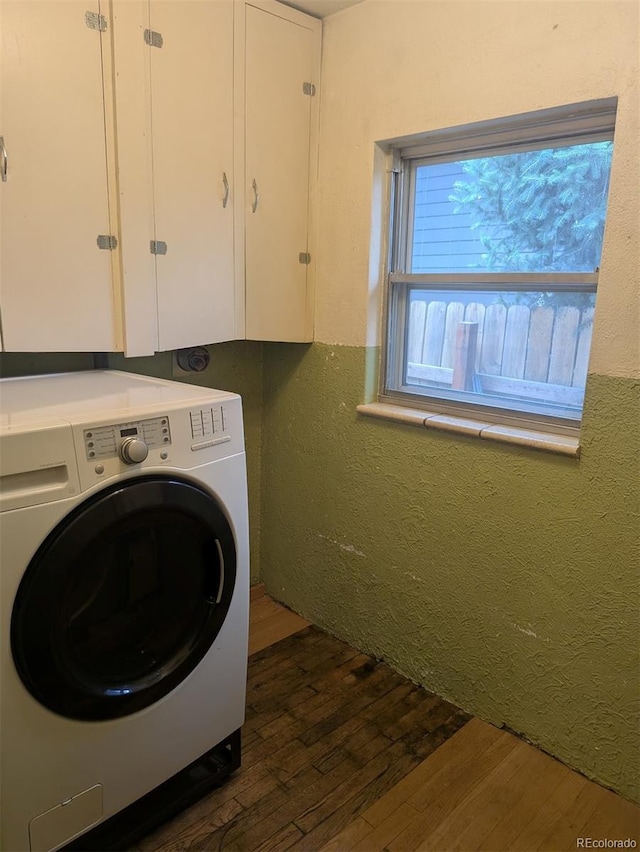 4209 Perry St, Denver, CO 80212 - washroom featuring washer / dryer, dark wood-type flooring, cabinet space, and a textured wall