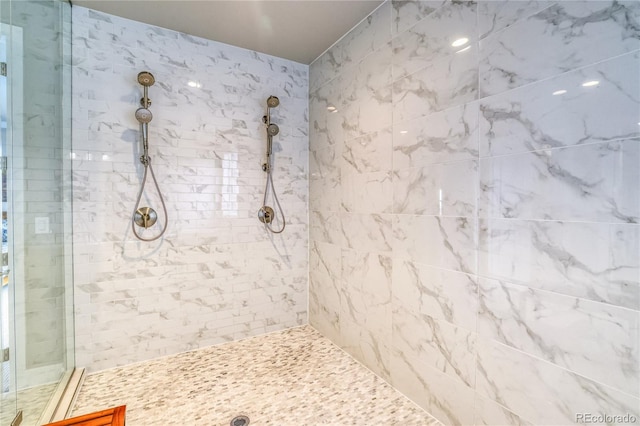 bathroom with a tile shower