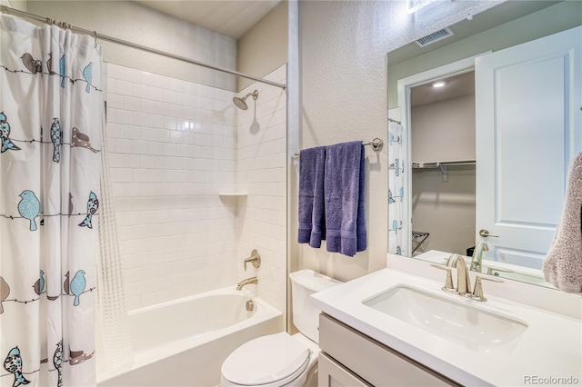 full bathroom featuring shower / bath combination with curtain, vanity, and toilet