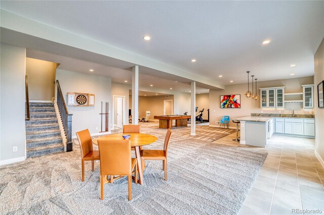 dining room with sink and light tile patterned floors