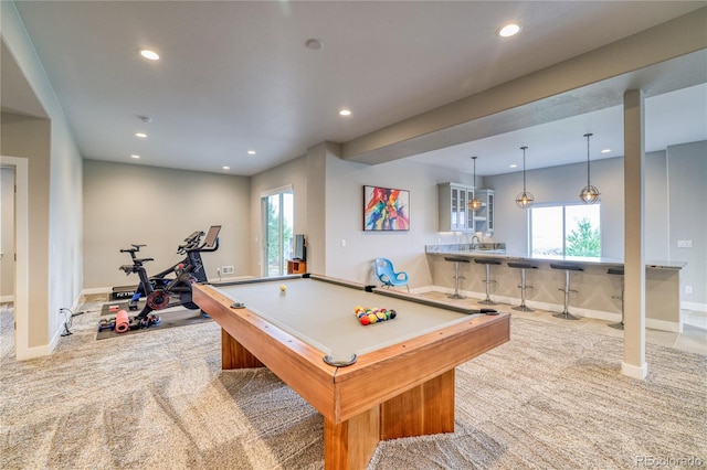 playroom featuring a wealth of natural light, light colored carpet, indoor bar, and pool table