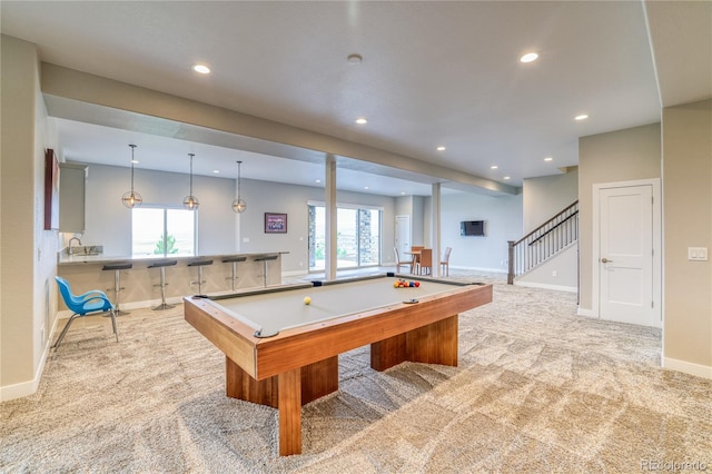 rec room featuring wet bar, light colored carpet, and pool table