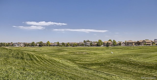 view of community featuring a residential view and a lawn