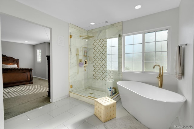 bathroom featuring shower with separate bathtub and tile patterned floors