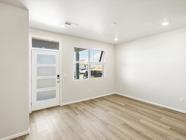 22360 E 8th Ave, Aurora, CO 80018 - unfurnished room with light wood-style flooring, recessed lighting, baseboards, and visible vents