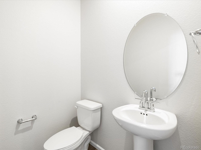 22360 E 8th Ave, Aurora, CO 80018 - half bath featuring a sink and toilet