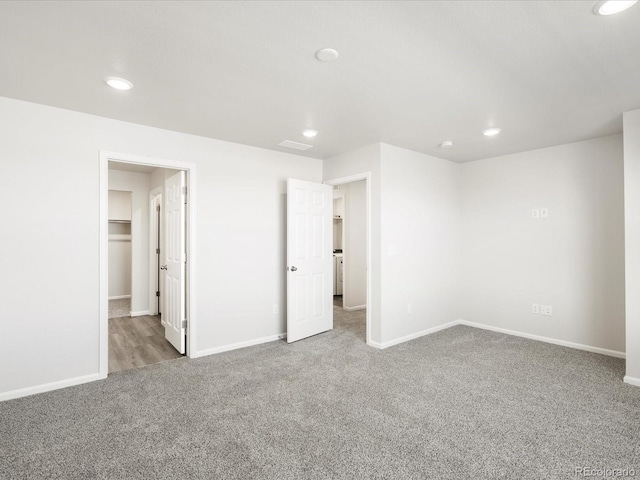 22360 E 8th Ave, Aurora, CO 80018 - unfurnished bedroom with baseboards, carpet floors, and recessed lighting