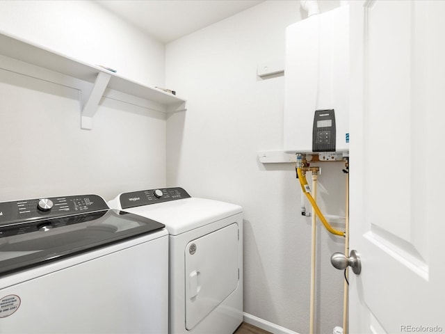 22360 E 8th Ave, Aurora, CO 80018 - clothes washing area with independent washer and dryer, tankless water heater, laundry area, and baseboards