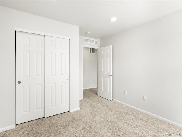 22360 E 8th Ave, Aurora, CO 80018 - unfurnished bedroom with carpet, baseboards, a closet, and visible vents