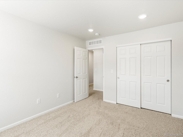 22360 E 8th Ave, Aurora, CO 80018 - unfurnished bedroom with baseboards, carpet floors, visible vents, and a closet