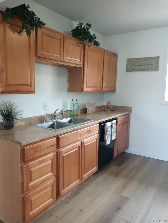 5640 E 67th Pl, Commerce City, CO 80022 - kitchen featuring a sink, light countertops, light wood-style floors, and dishwasher