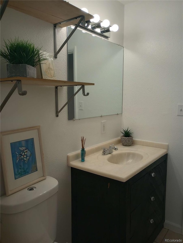 5640 E 67th Pl, Commerce City, CO 80022 - half bathroom featuring vanity and toilet