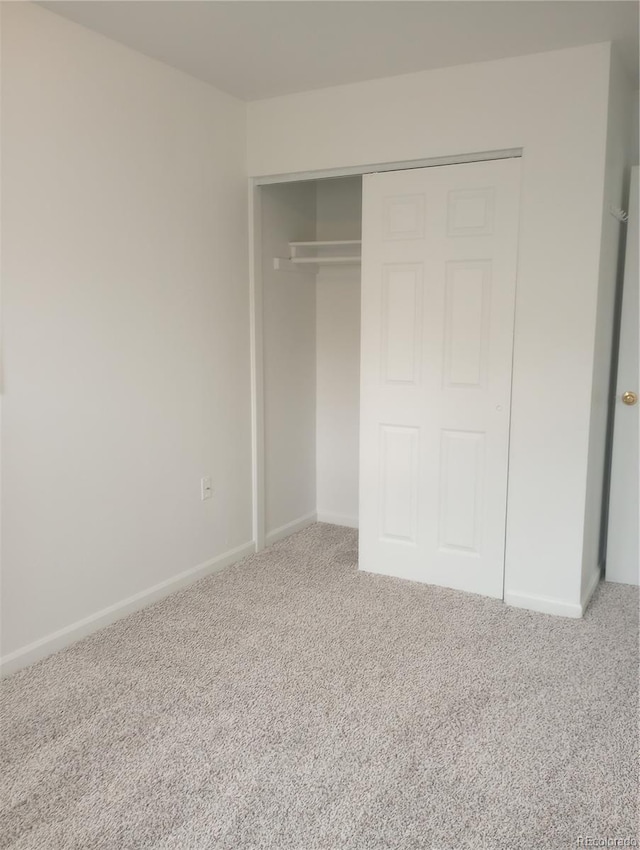 5640 E 67th Pl, Commerce City, CO 80022 - unfurnished bedroom featuring a closet, carpet flooring, and baseboards