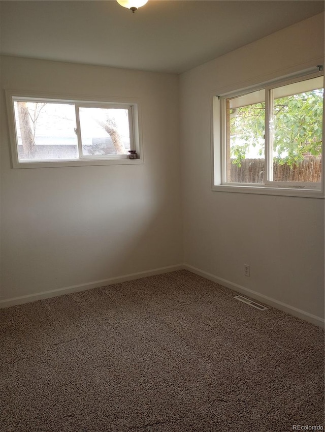 5640 E 67th Pl, Commerce City, CO 80022 - carpeted spare room featuring visible vents and baseboards