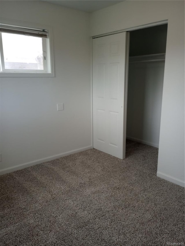 5640 E 67th Pl, Commerce City, CO 80022 - unfurnished bedroom featuring carpet floors, baseboards, and a closet