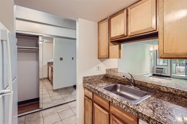 1265 Elizabeth St Unit 207, Denver, CO 80206 - kitchen featuring light tile patterned flooring, light brown cabinetry, cooling unit, tile countertops, and freestanding refrigerator