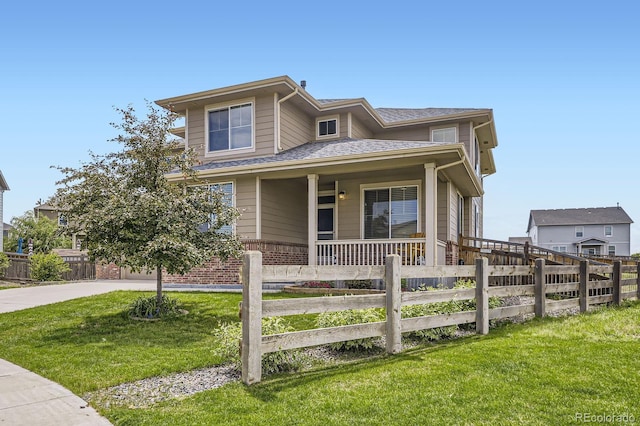 785 Iris St, Brighton, CO 80601 - view of front of house with covered porch, a shingled roof, and concrete driveway