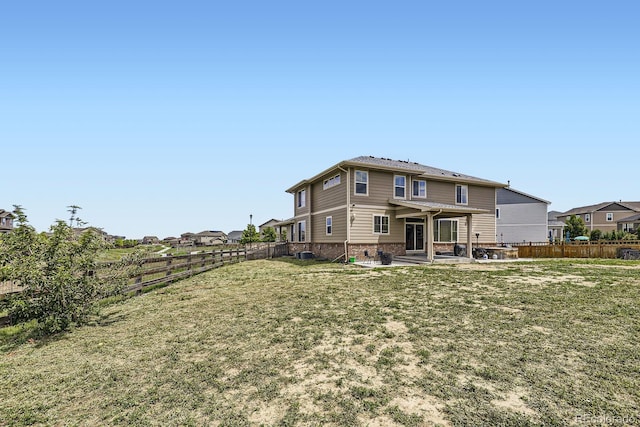 785 Iris St, Brighton, CO 80601 - rear view of property with a patio, a fenced backyard, and brick siding