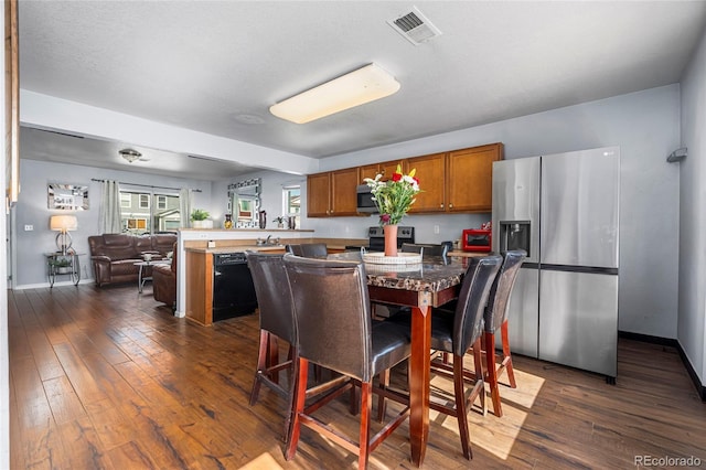 4528 Andes St, Denver, CO 80249 - dining room with dark wood-style flooring and baseboards